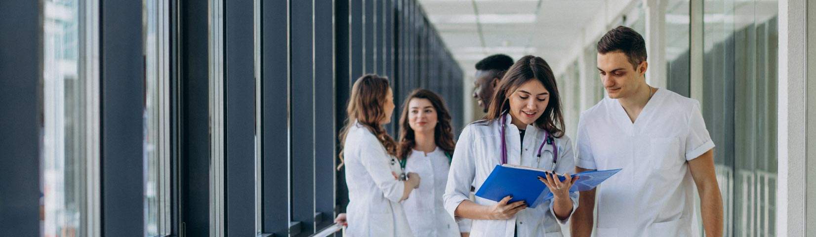 team young specialist doctors standing corridor hospital